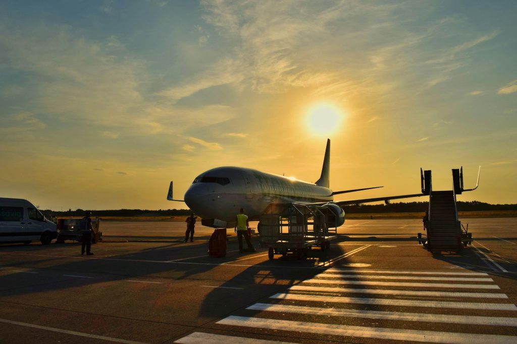 Aircraft on an airport apron at sunset