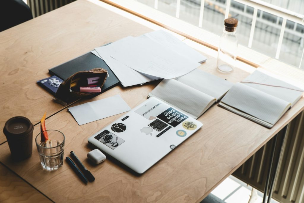 Compliance documents on a meeting table